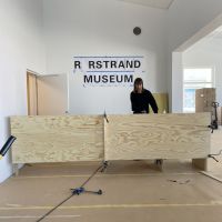 Rörstrand Museum The reception neon sign as A4 printouts and the desk as two ply sheets. Testing scale, proportions and dimensions. WIP snap. Spring 2021.